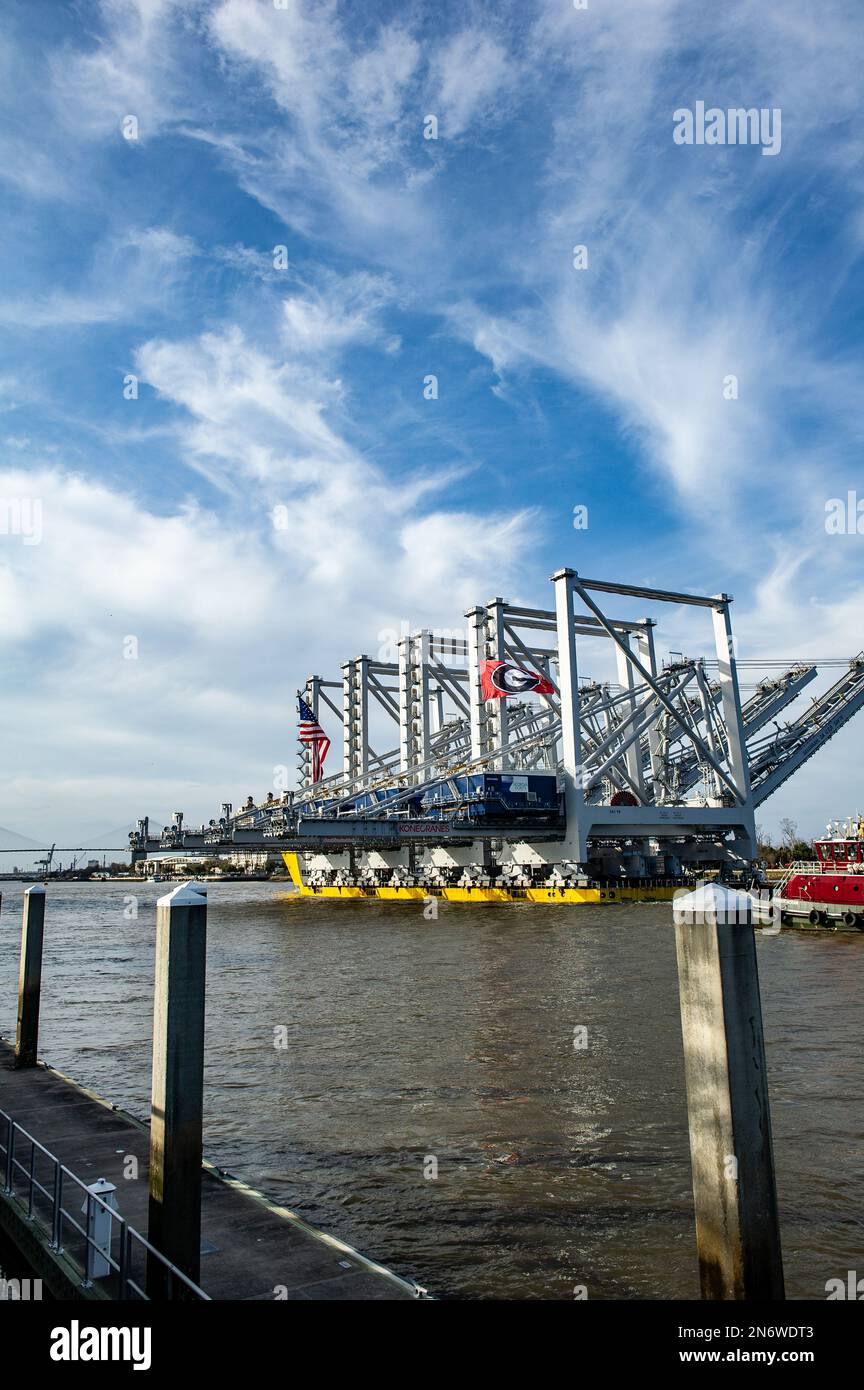 The Port of Savannah received a massive delivery Thursday: four towering ship-to-shore cranes delivered on heavy load carrier named BigLift Baffin. Stock Photo