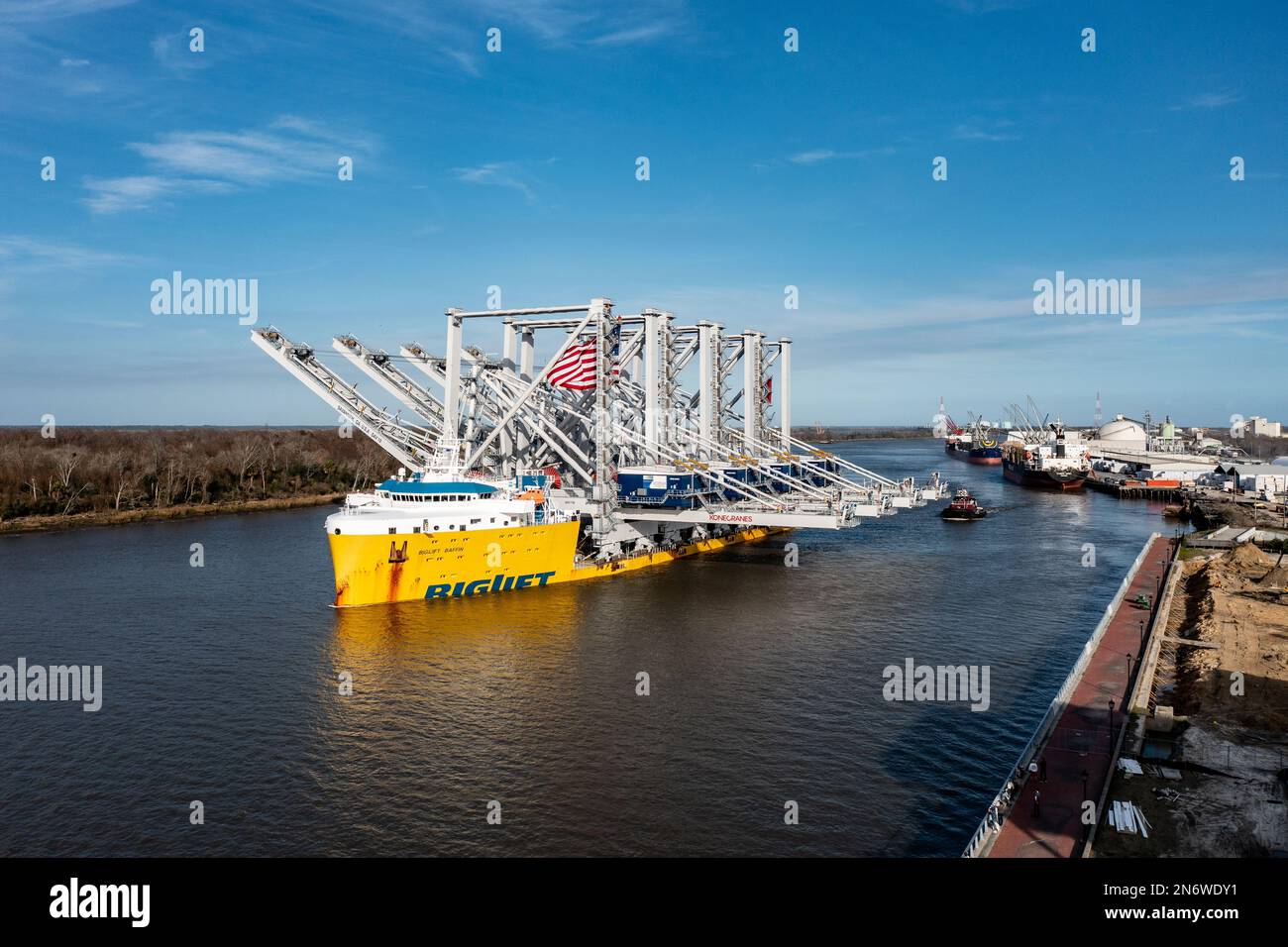 The Port of Savannah received a massive delivery Thursday: four towering ship-to-shore cranes delivered on heavy load carrier named BigLift Baffin. Stock Photo