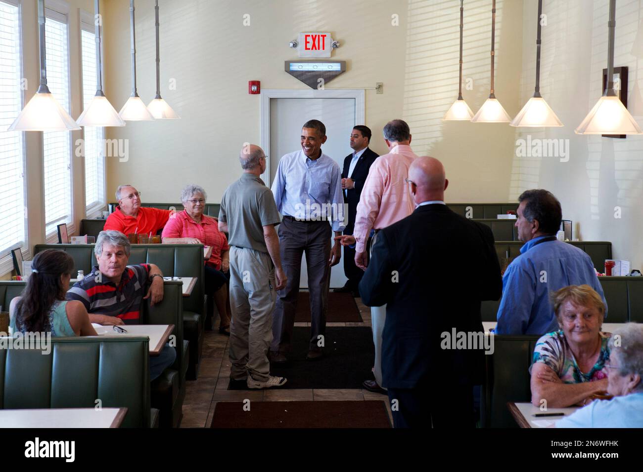 President Barack Obama visits with patrons in Bingham's Family