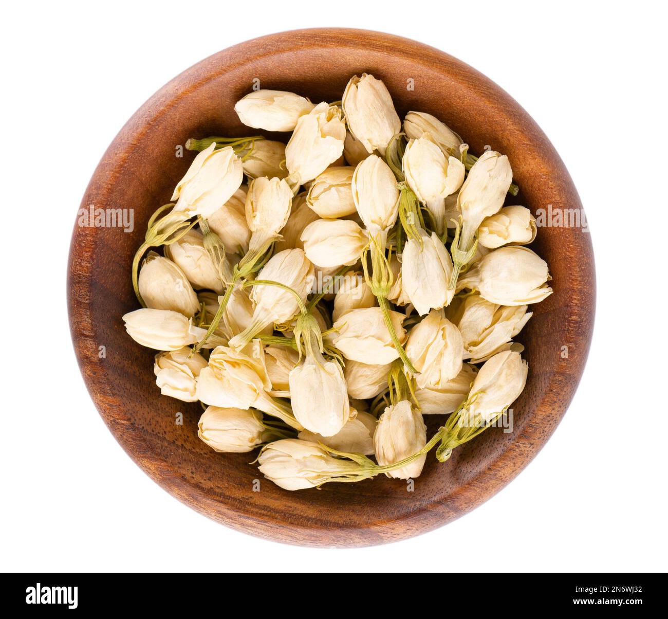 Dry jasmine flowers in wooden bowl, isolated on white background