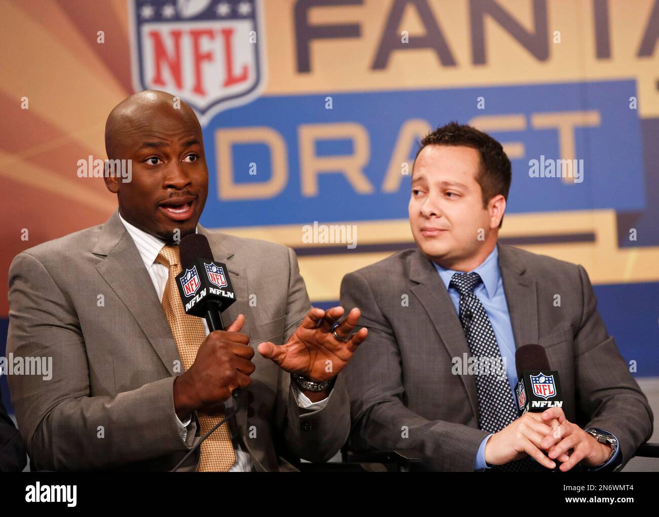 Former NFL player Akbar Gbaja-Biamila and Michael Fabiano are seen at the  Panel discussion and Fantasy Live taping on August 22, 2013, in New York  City. (Brian Ach/AP Images for NFL Stock