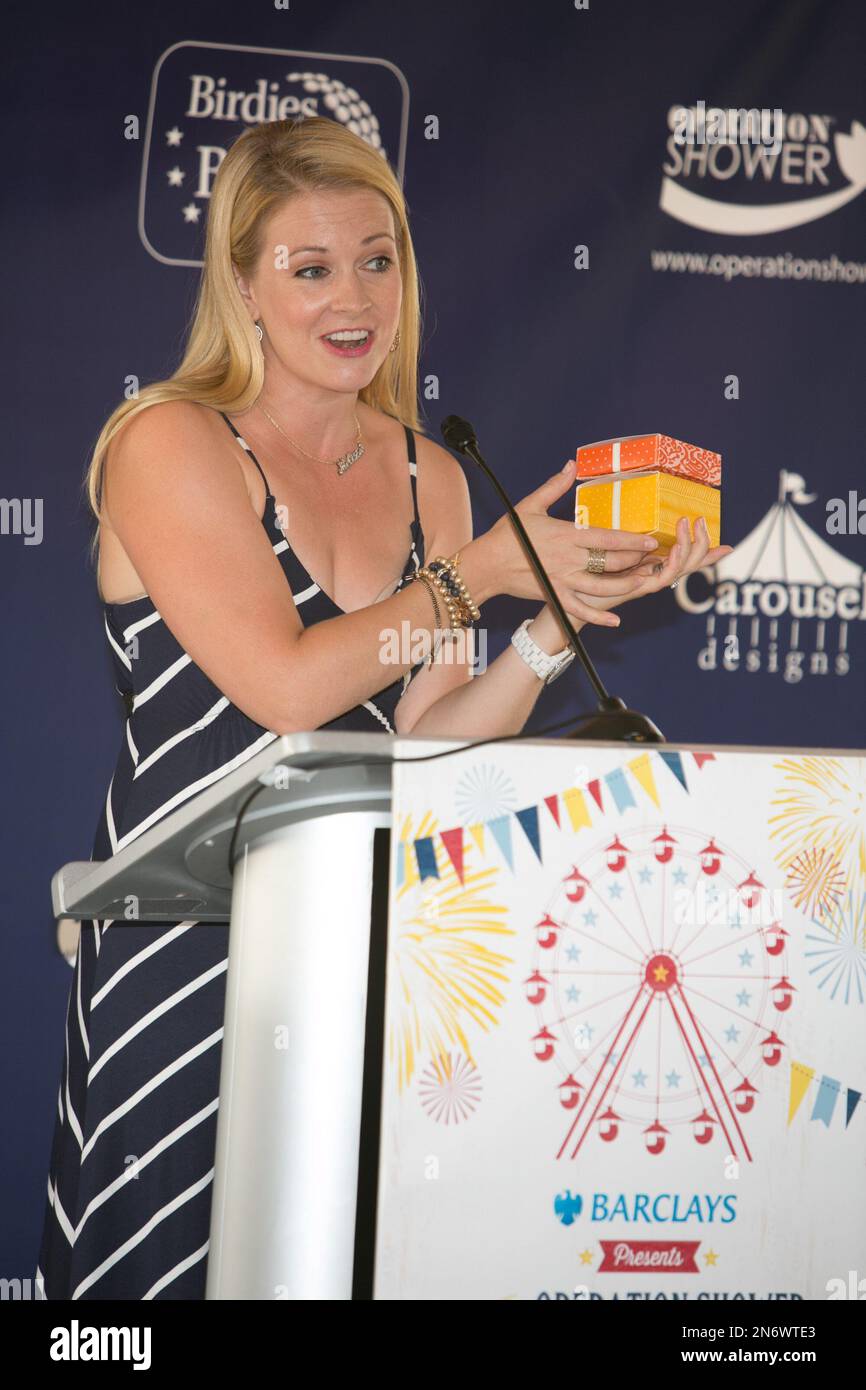 Actress Melissa Joan Hart speaks at the podium at Operation Shower and
