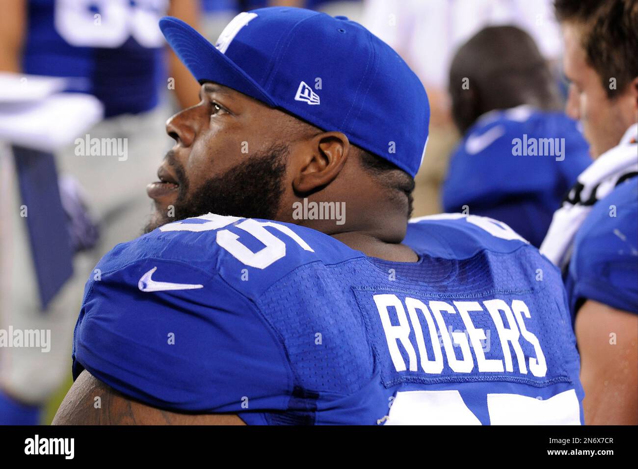 New York Giants defensive tackle Shaun Rogers (95) looks on during the second half of an NFL preseason football game against the Indianapolis Colts Sunday, Aug. 18, 2013, in East Rutherford, N.J. (AP Photo/Bill Kostroun) Stock Photo