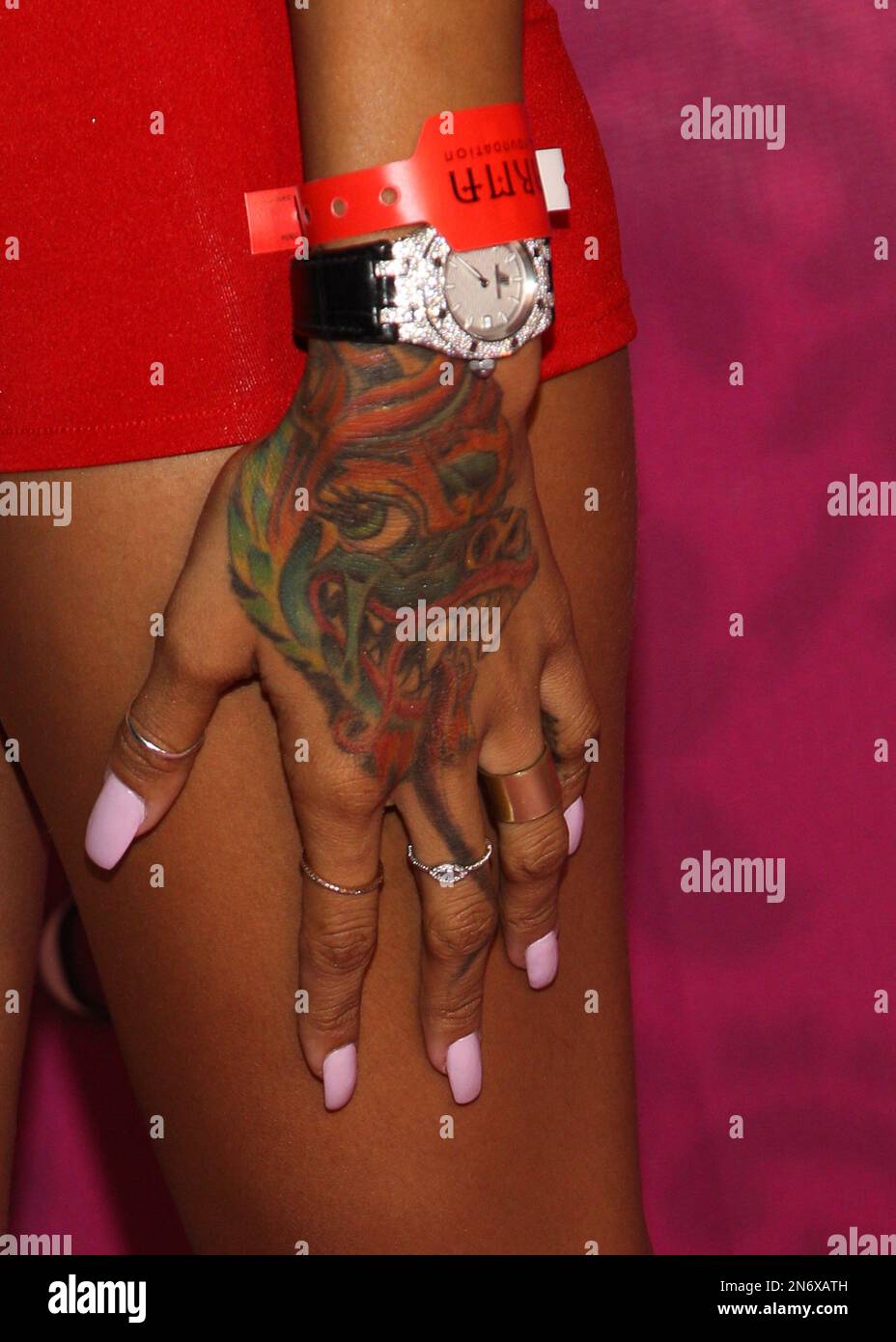 Karrueche Tran (tattoo detail) arrives at Kandyland 2013: A Decade of  Decadent Dreams on Saturday, Aug. 17, 2013 in Beverly Hills, Calif. (Photo  by Paul A. Hebert/Invision/AP Stock Photo - Alamy, image size:928x1390