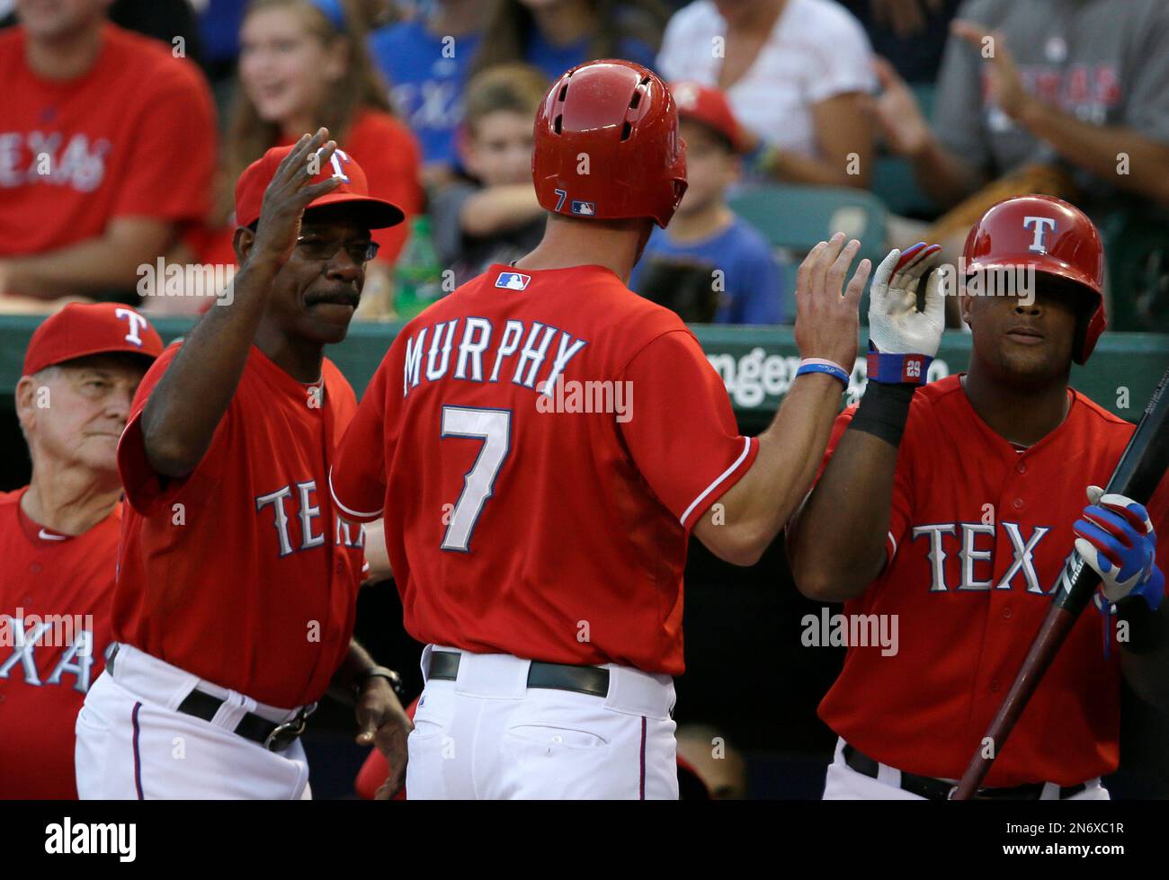 Texas Rangers' Jackie Moore, from left, athletic trainer Jamie