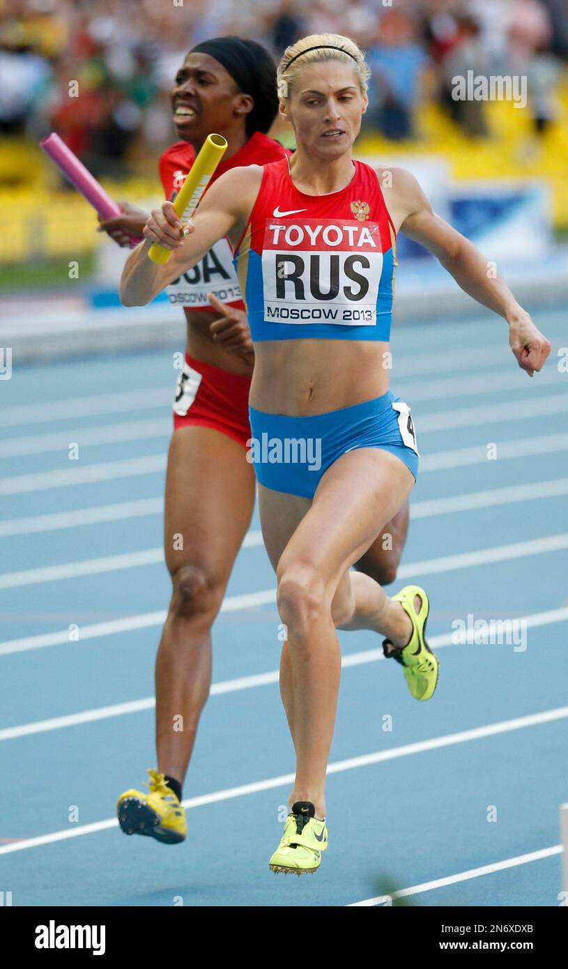 Russia's Antonina Krivoshapka, right, competes in the women's 4x400
