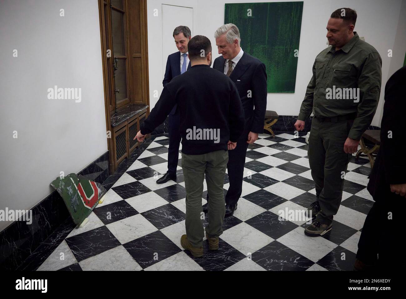 Brussels, Belgium. 09th Feb, 2023. Ukrainian President Volodymyr Zelenskyy, presents King Philippe of Belgium, center, with a fragment of a Russian Su-25 aircraft shot down by Ukrainian pilots at the Royal Palace, February 9, 2023 in Brussels, Belgium. Credit: Pool Photo/Ukrainian Presidential Press Office/Alamy Live News Stock Photo