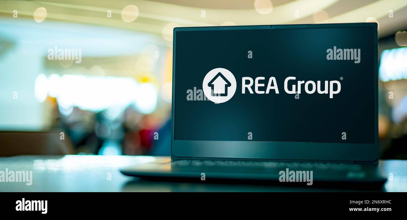 POZNAN, POL - JUN 28, 2022: Laptop computer displaying logo of REA Group, a global online real estate advertising company Stock Photo