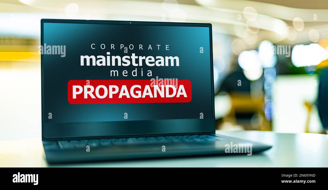 A laptop computer displaying the watchword: mainstream media propaganda Stock Photo