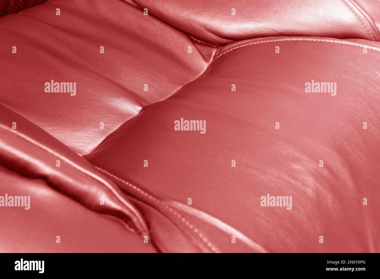 Modern luxury car red leather interior. Part of red leather car seat