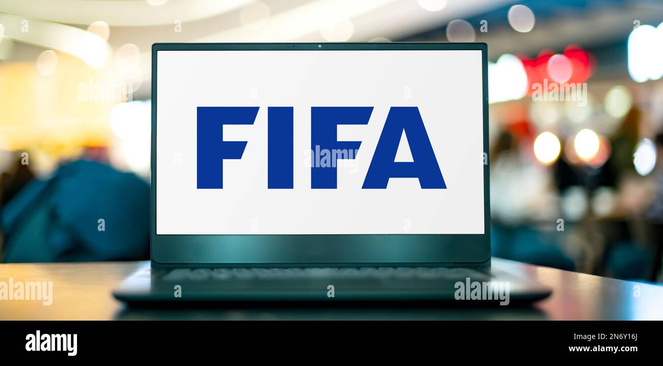 POZNAN, POL - NOV 22, 2022: Laptop computer displaying logo of FIFA, an international governing body of association football, beach football and futsa Stock Photo