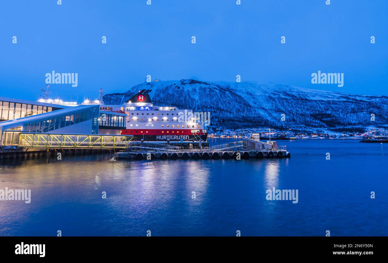 Tromso, Norway, March 4th 2022: Pier for Hurtigruten ships. Hurtigruten (english Express Route) is a Norwegian public coastal route transporting passe Stock Photo
