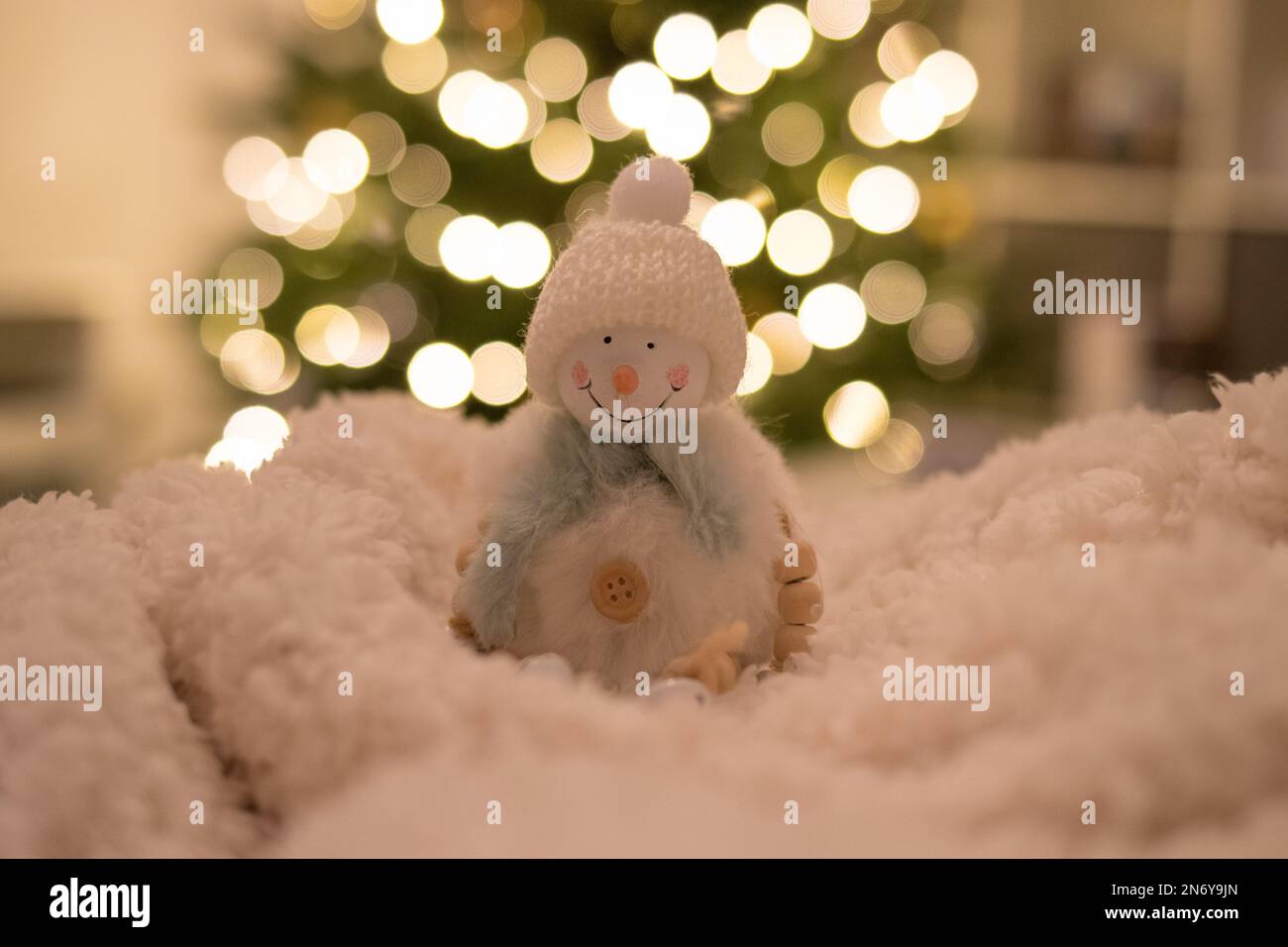 Snowman figure with lights bokeh in the background Stock Photo Alamy
