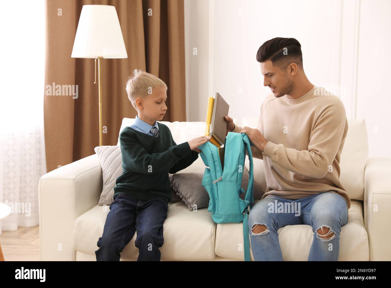 Child school uniform adult home hi-res stock photography and images - Alamy