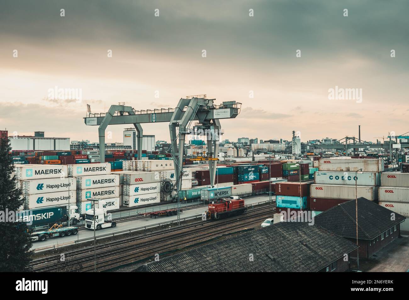 Mannheim, Germany - 26.03.2021: Freight containers in the container port of the inland port of Mannheim on a cloudy day Stock Photo