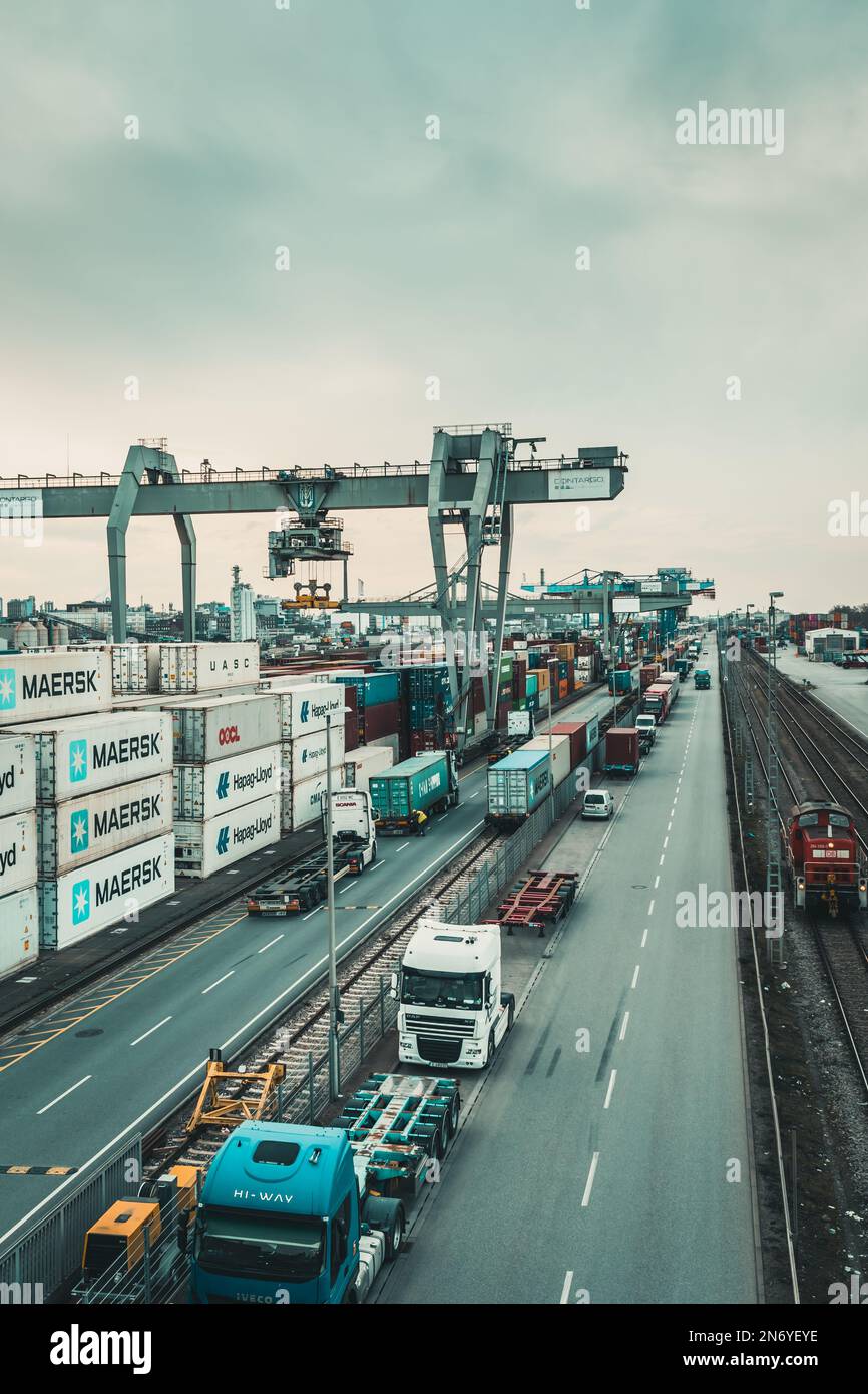 Mannheim, Germany - 26.03.2021: Freight containers in the container port of the inland port of Mannheim, vertical Stock Photo
