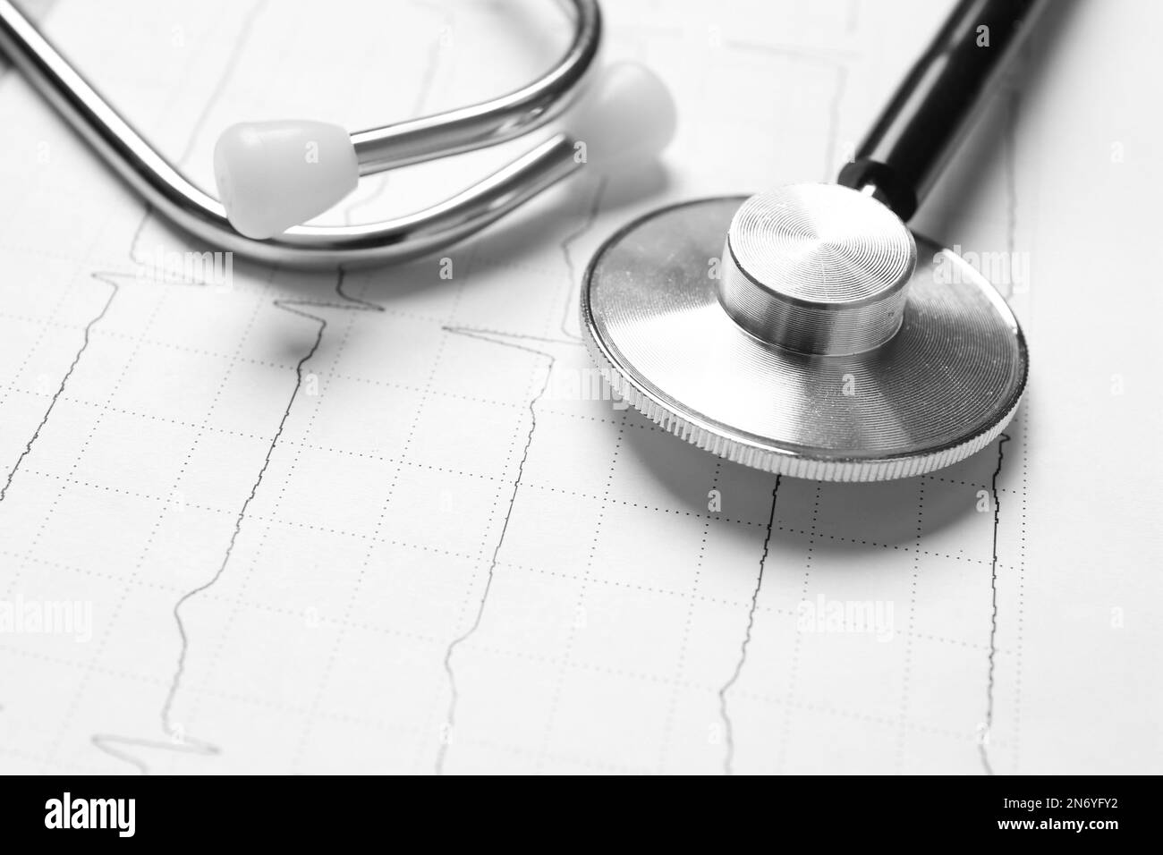 Stethoscope on cardiogram report, closeup view. Heart diagnosis Stock