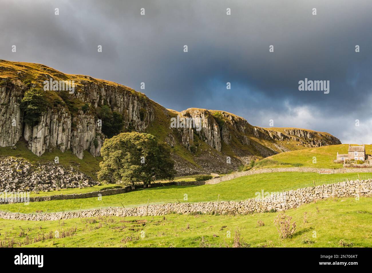 Very strong autumn sunshine in a bright interval on the dramatic Holwick Scar, Upper Teesdale Stock Photo