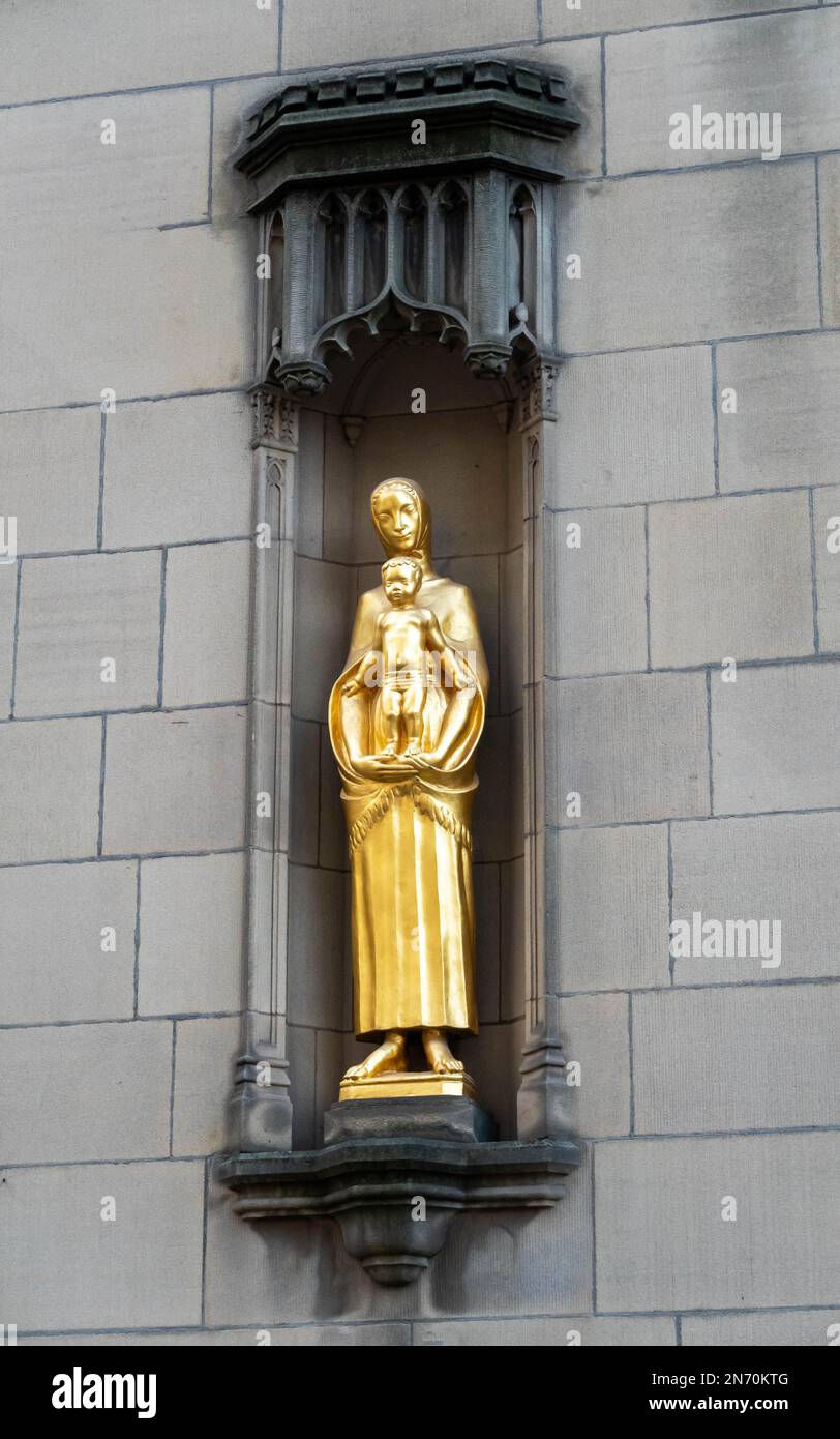 Baby Jesus with Virgin Mary gold statue outside Manchester Cathedral