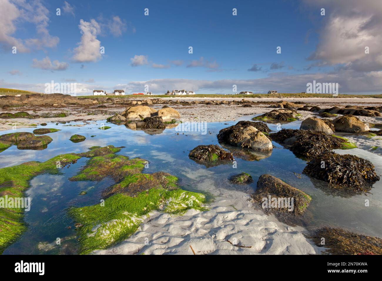 Rock pools at low tide near the village of Balemartine on the Isle of Tiree, Scotland. Stock Photo