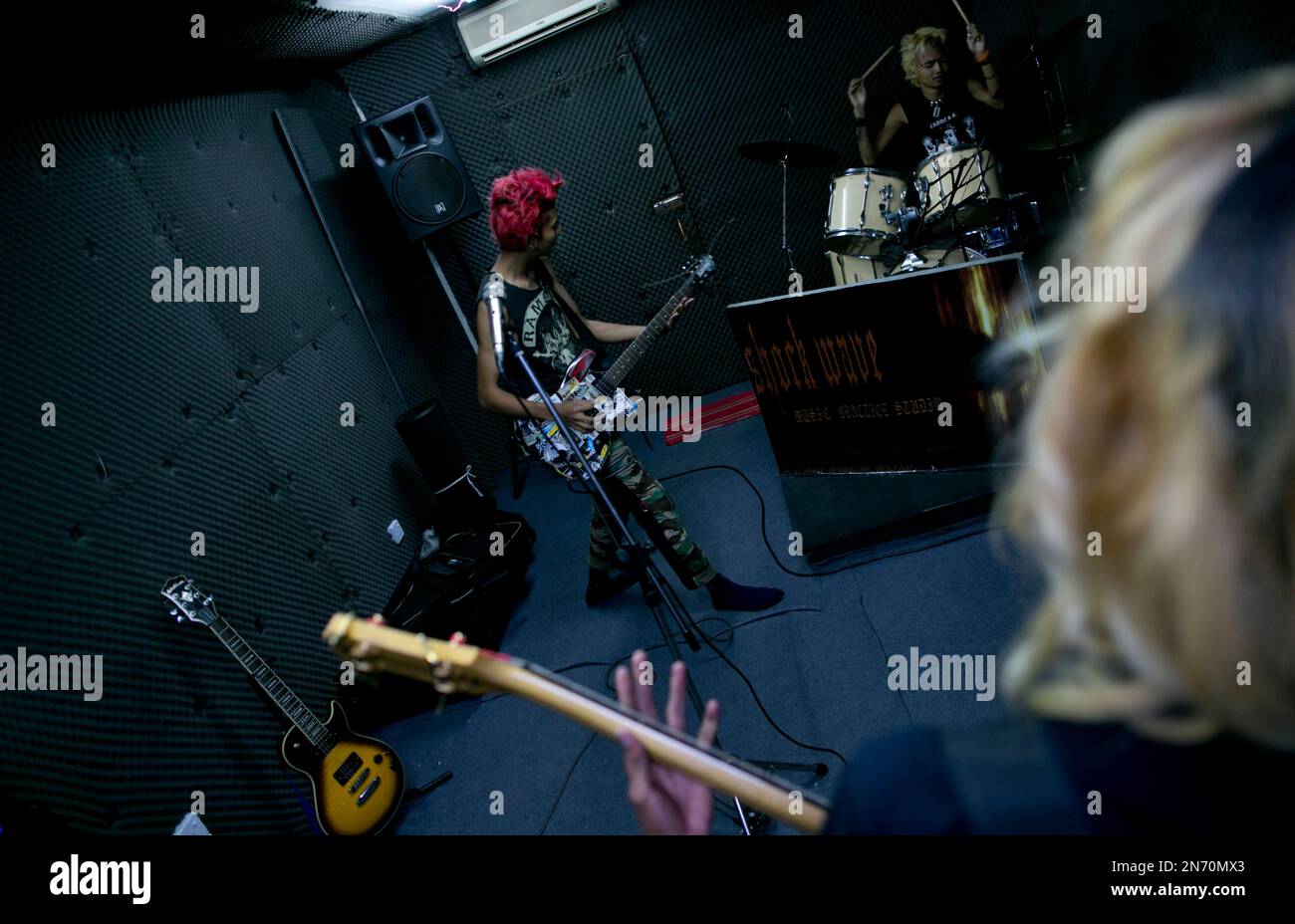 In this Tuesday, July 9, 2013 photo, Kyaw Kyaw, left, and members of ...