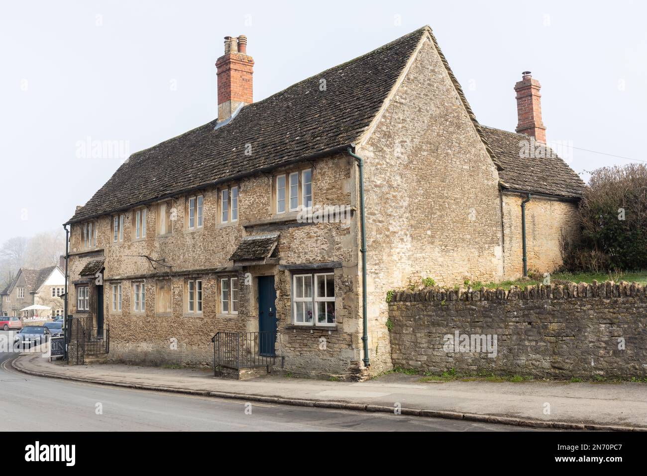 Lovely old traditional stone cottage in the English village of Lacock in winter, Wiltshire, England, UK Stock Photo