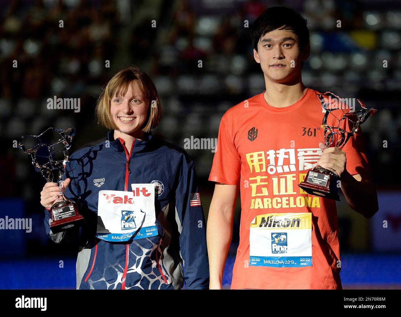 Katie Ledecky of the Unted States, left, holds the FINA Best Female Swimmer of the event trophy and China's Sun Yang holds the Best Male swimmer trophy at the FINA Swimming World Championships in Barcelona, Spain, Sunday, Aug. 4, 2013. (AP Photo/Manu Fernandez) Stock Photo