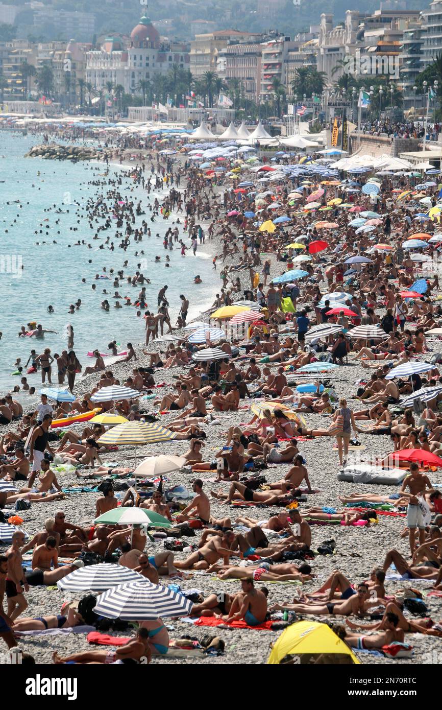 People crowd the beach in Nice, on the Cote d'Azur, in southeastern