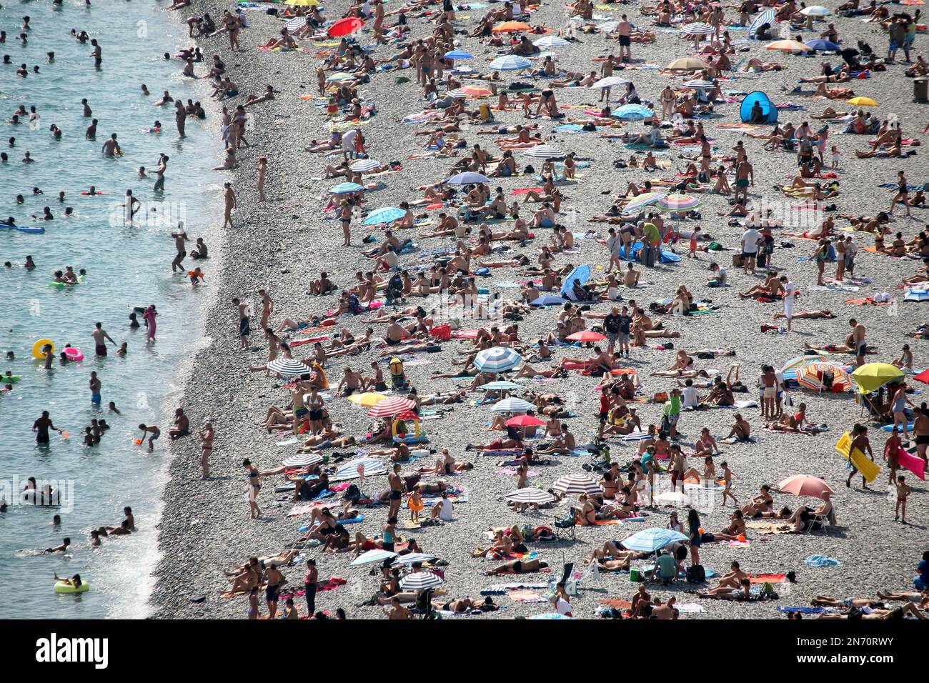 People crowd the beach in Nice, on the Cote d'Azur, in southeastern
