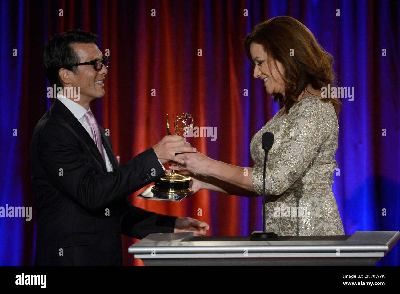 David Ono, of ABC7, left, accepts the award for outstanding writer ...