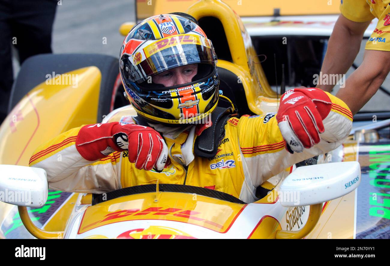 Ryan Hunter-Reay climbs from his car after qualifying for the IndyCar