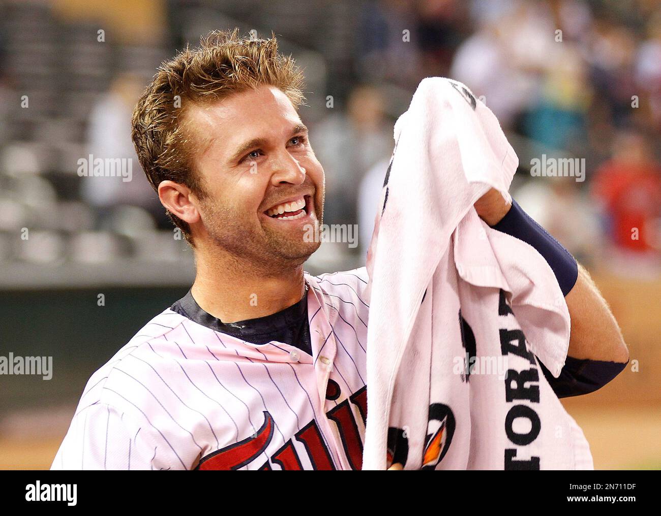 Minnesota Twins Brian Dozier smiles after getting a Gatorade bath by  teammates during a media interview after Dozier hit the game winning single  in the 13th inning against the Houston Astros during