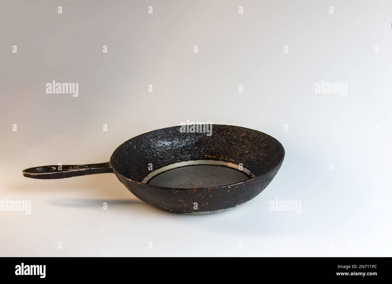 An old cast iron skillet made in circa 1960 against a white background Stock Photo Alamy