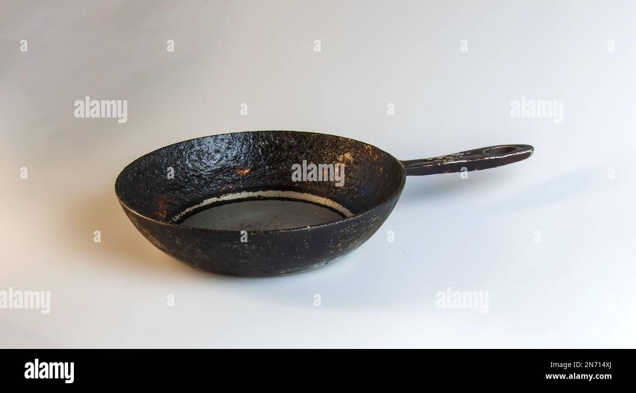 An old cast iron skillet made in circa 1960 against a white background Stock Photo Alamy
