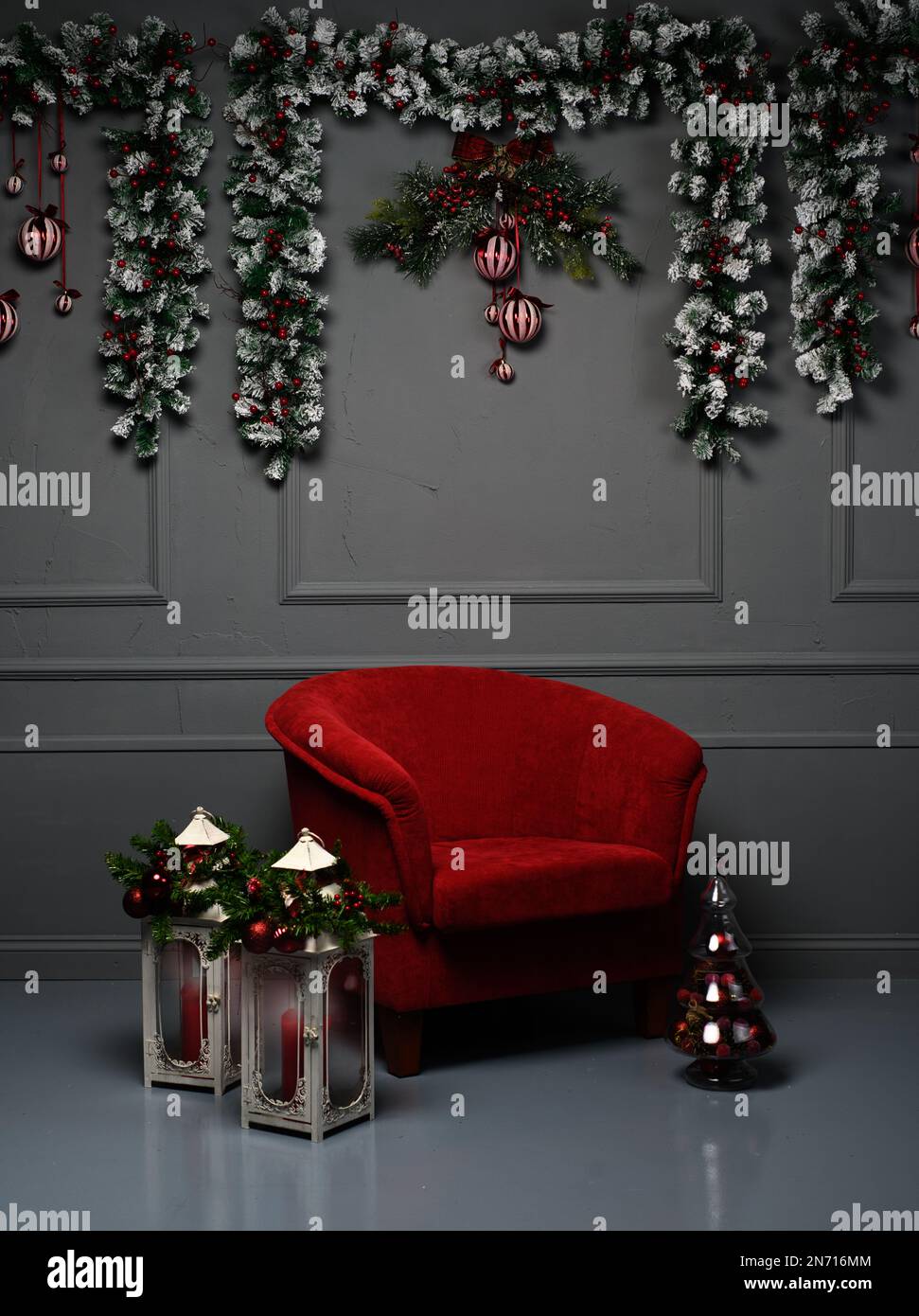 Armchair in a living room with lanterns and Christmas decorations Stock Photo