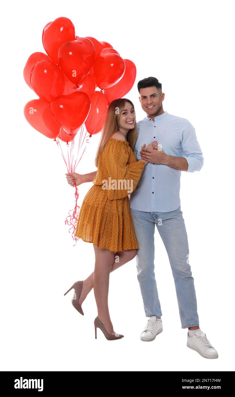 Lovely couple with heart shaped balloons on white background. Valentine ...