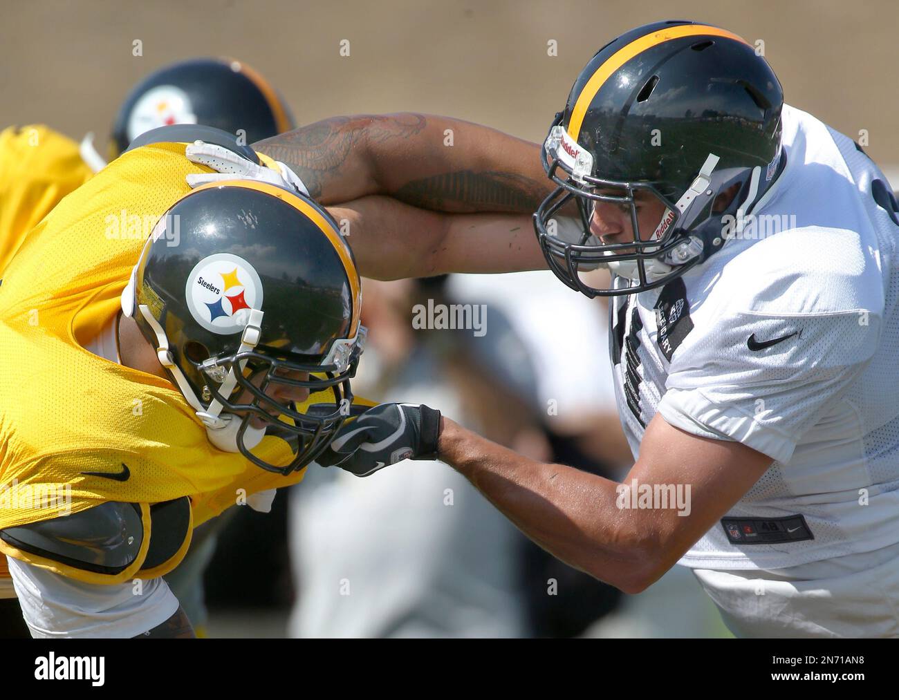 Pittsburgh Steelers tackle Guy Whimper, right, tries to block linebacker  LaMarr Woodley (56) during practice at NFL football training camp at the  team's training facility in Latrobe, Pa., on Thursday, Aug. 1,