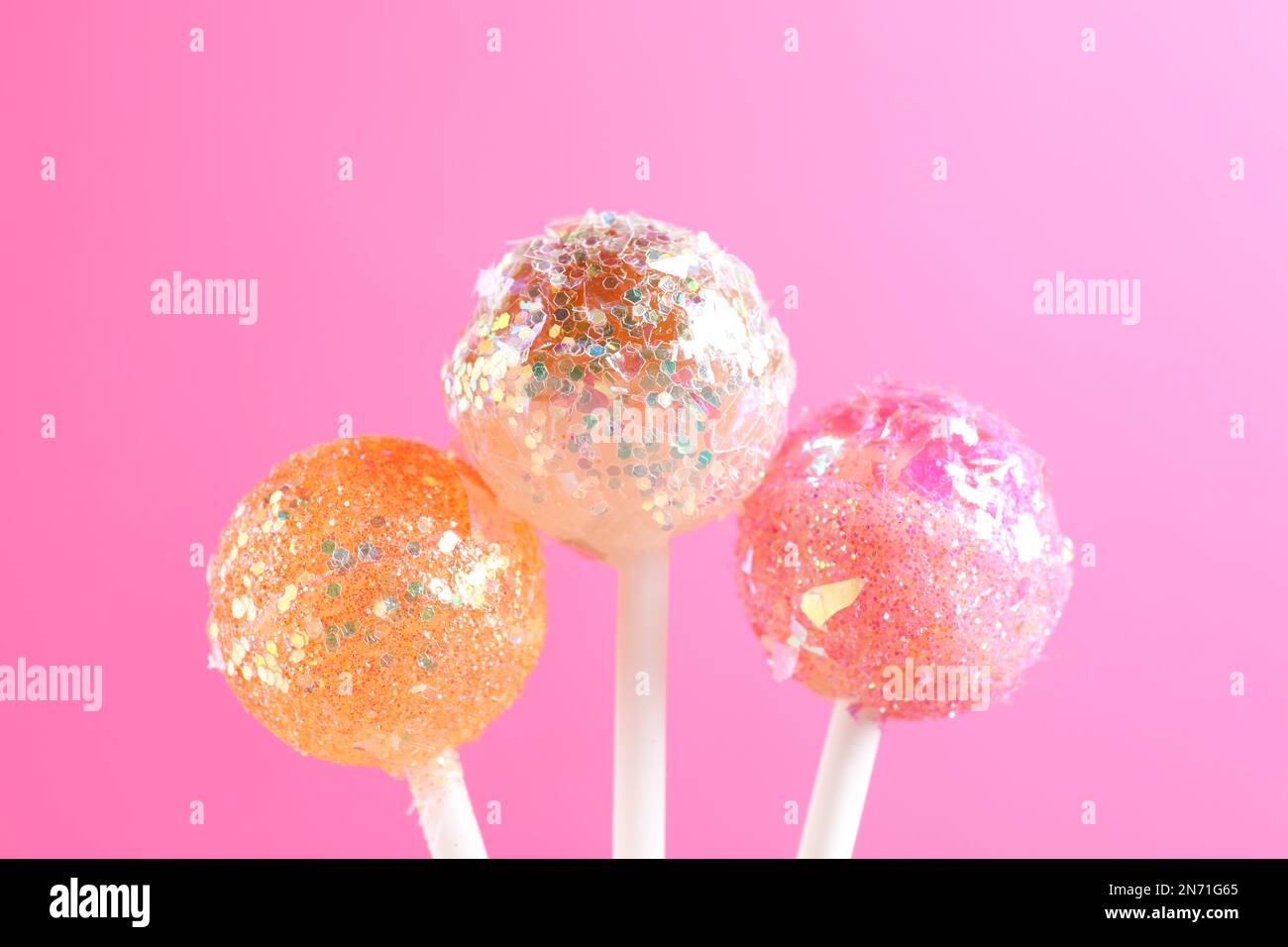 Round candies on sticks hi-res stock photography and images - Alamy