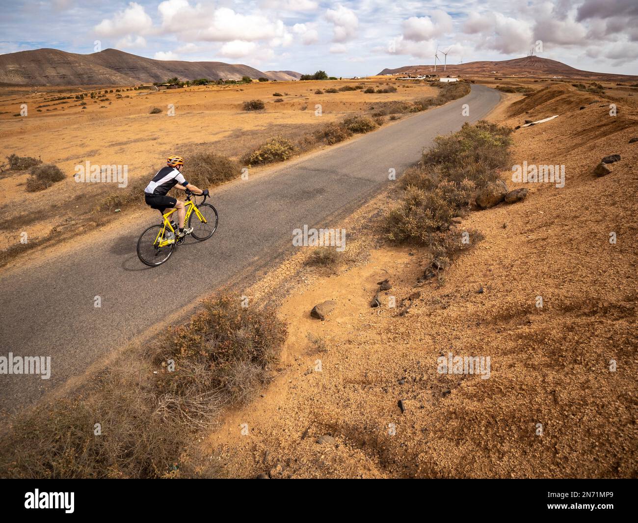 Road cyclist on lonely side road between La Matilla and El Time, Canary Islands, Spain Stock Photo
