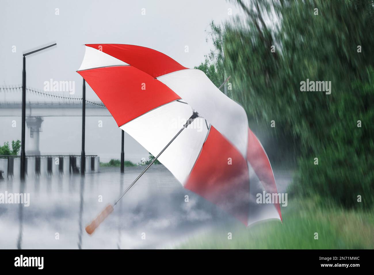 Wind blown umbrella hi-res stock photography and images - Alamy