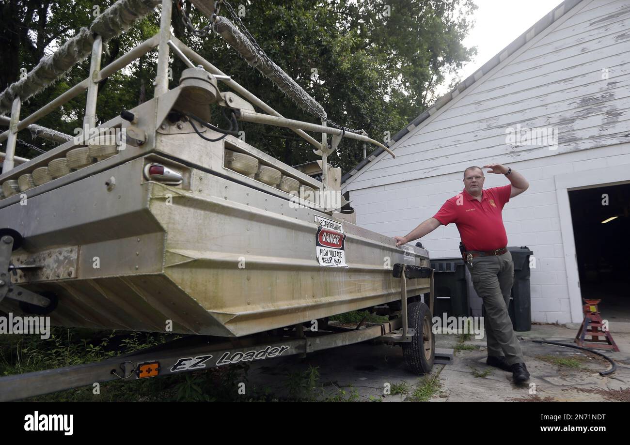 Morven Police Chief Lynwood Yates stands next to a government surplus
