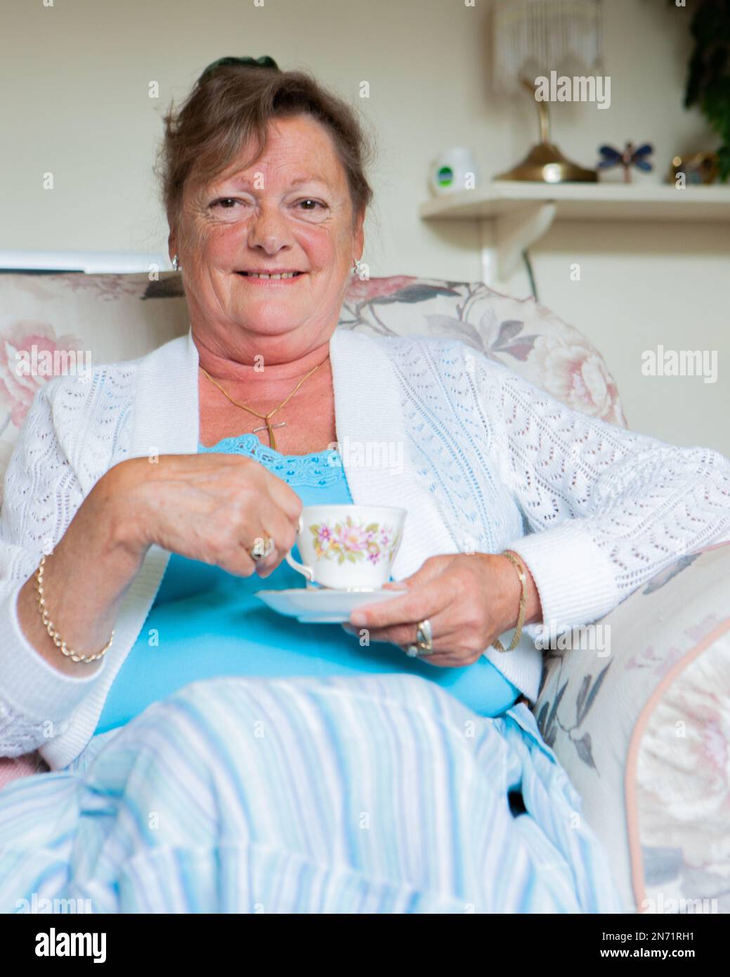 Retirement tea break. A friendly smiling senior British lady in her