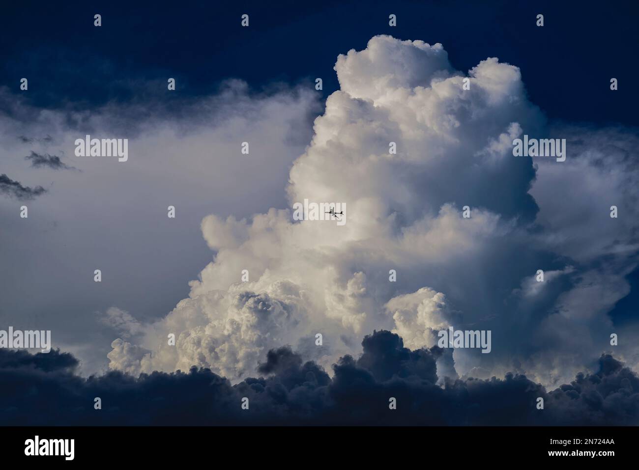 Airplane flying cumulus clouds hi-res stock photography and images - Alamy