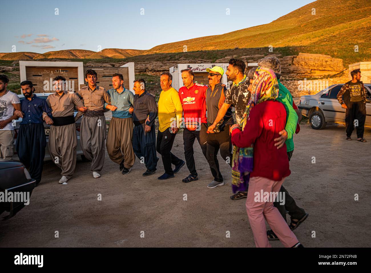 A group of Kurdish people dancing near Takht-e Soleyman in West Azerbaijan Province, Iran Stock Photo
