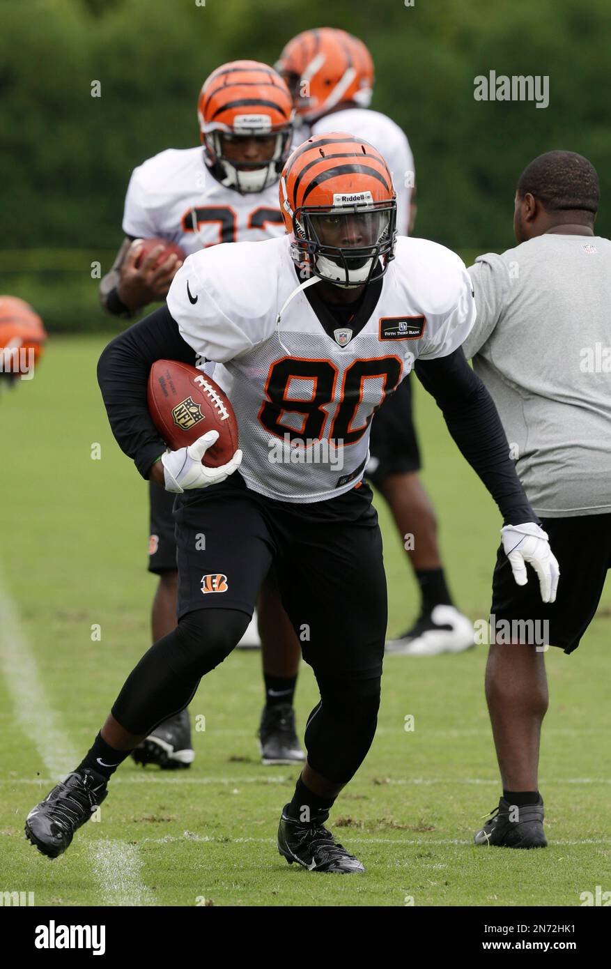 Cincinnati Bengals tight end Orson Charles loosens up during the NFL  football team's scheduled OTA, Tuesday, May 29, 2012, in Cincinnati. (AP  Photo/Al Behrman Stock Photo - Alamy