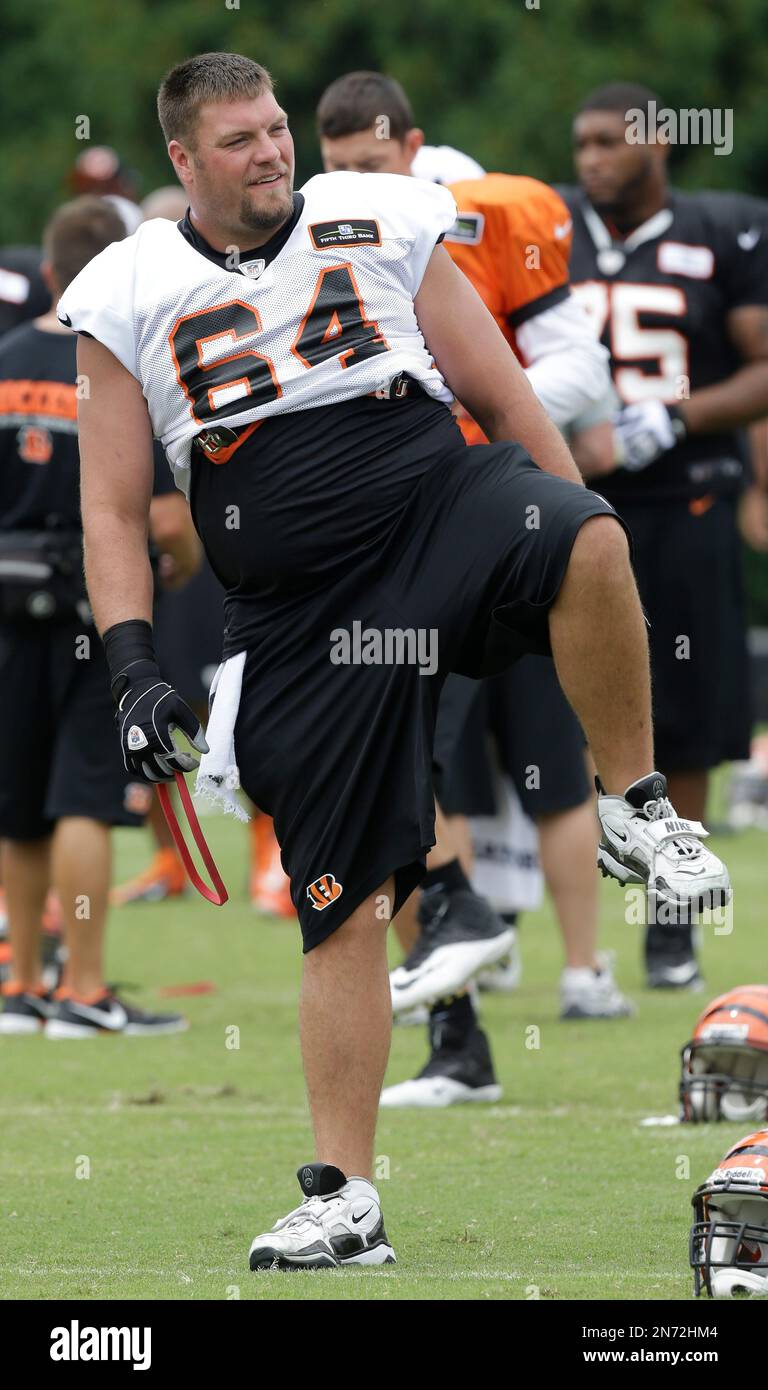 Cincinnati Bengals center Kyle Cook loosens up during practice at the NFL  football team's training camp, Saturday, July 27, 2013, in Cincinnati. (AP  Photo/Al Behrman Stock Photo - Alamy