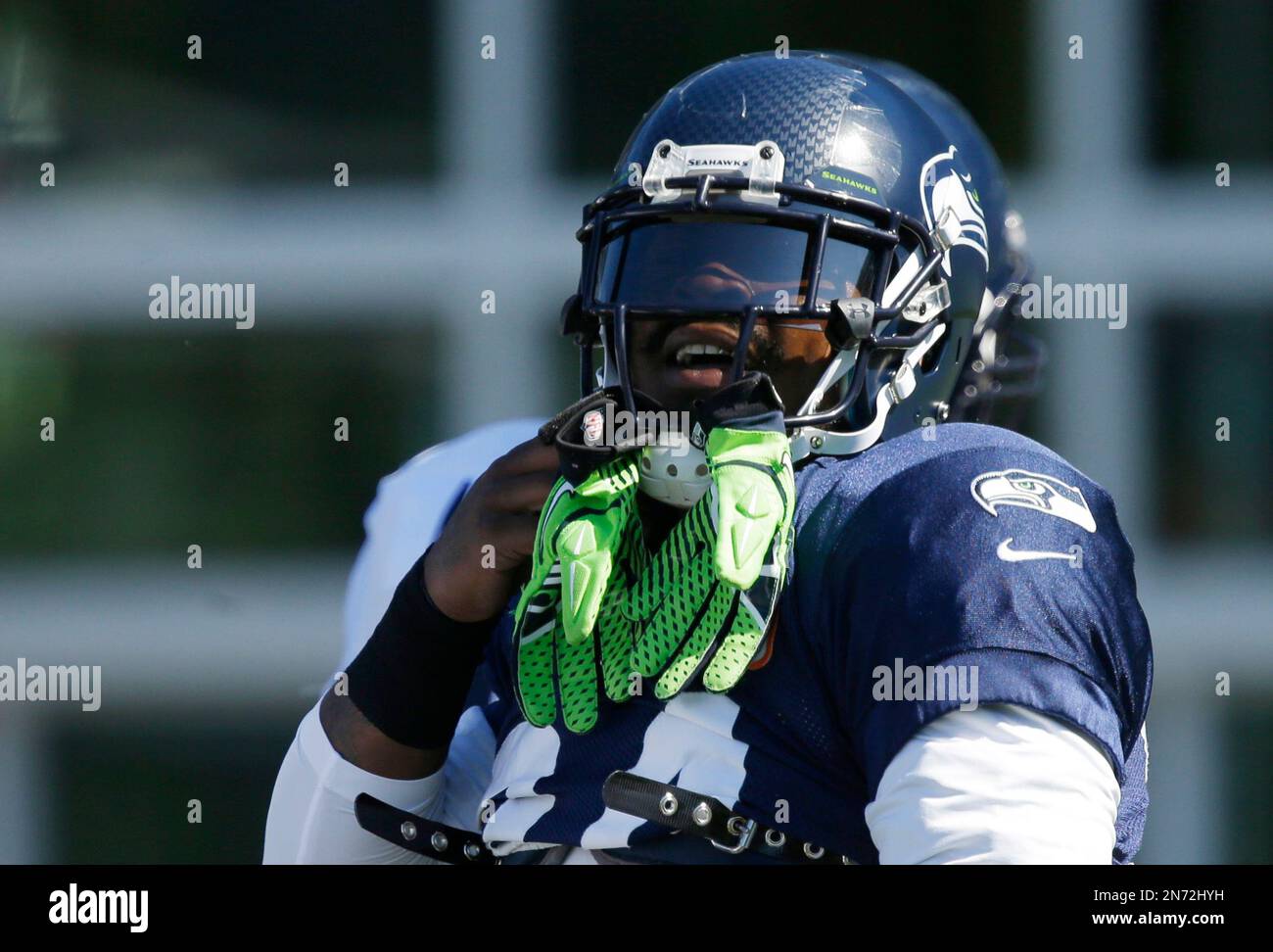 Seattle Seahawks' Marshawn Lynch wears his gloves on his helmet during NFL  football training camp, Saturday, July 27, 2013, in Renton, Wash. (AP  Photo/Ted S. Warren Stock Photo - Alamy