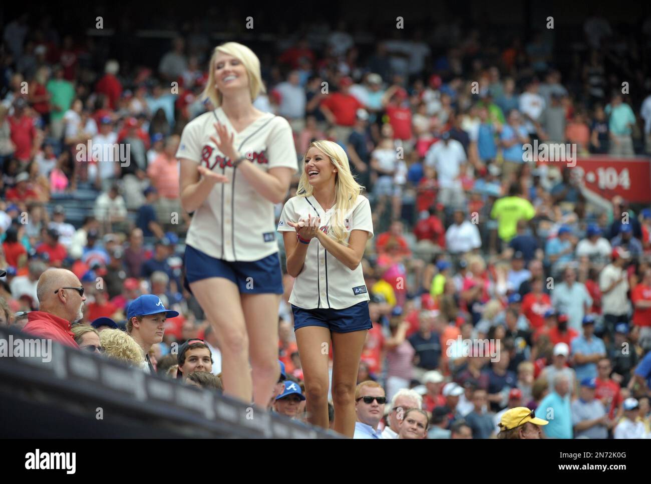 The Atlanta Braves girls dance atop the dugout during the seventh inning of  a baseball game against the St. Louis Cardinals at Turner Field, Saturday,  July 27, 2013, in Atlanta. (AP Photo/David