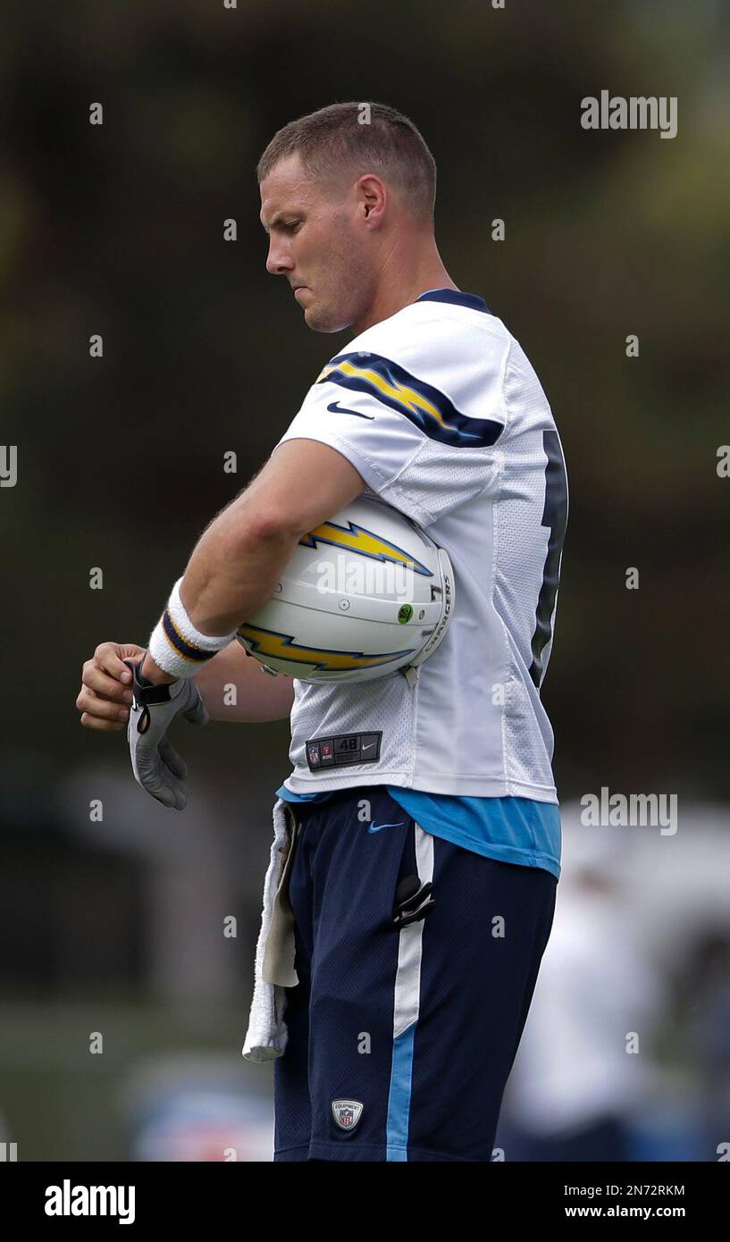 San Diego Chargers quarterback Philip Rivers adjusts a glove he wears