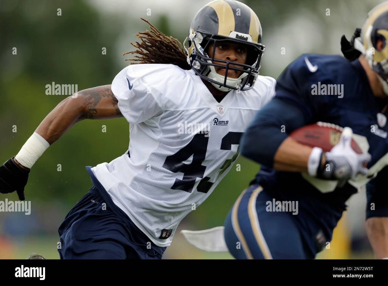 Oakland, California, USA. 17th Dec, 2006. St. Louis Rams defensive back  Ronald Bartell (24) runs with ball intended for Oakland Raiders wide  receiver Johnnie Morant (19) on Sunday, December 17, 2006, in